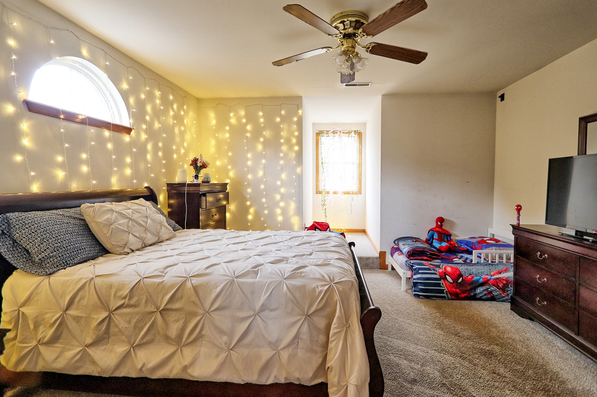 809 Nathan Drive Columbia, TN 38401 - Photo 32 of 41 a bedroom with a bed and a chandelier