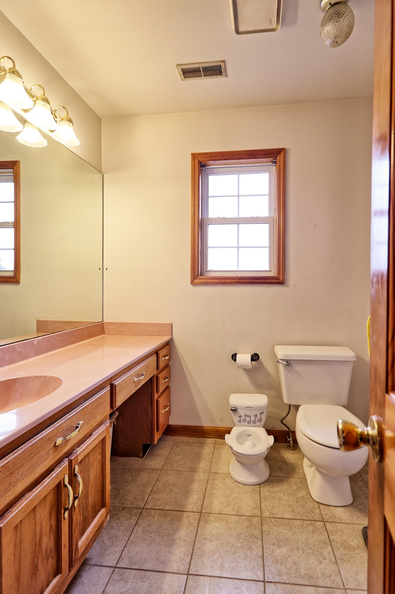 809 Nathan Drive Columbia, TN 38401 - Photo 34 of 41 a bathroom with a granite countertop toilet sink and mirror