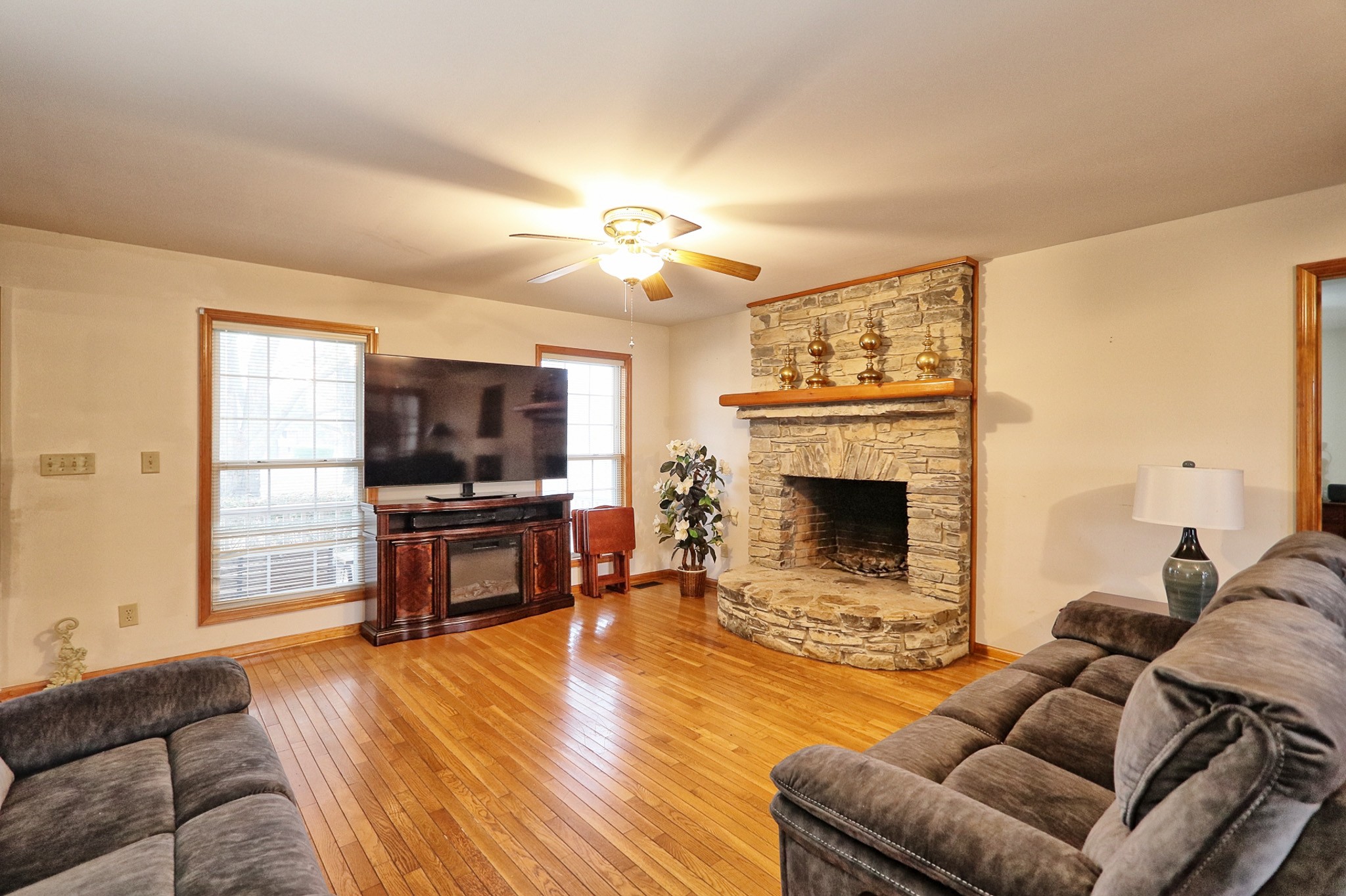 809 Nathan Drive Columbia, TN 38401 - Photo 6 of 41 a living room with furniture a flat screen tv and a fireplace