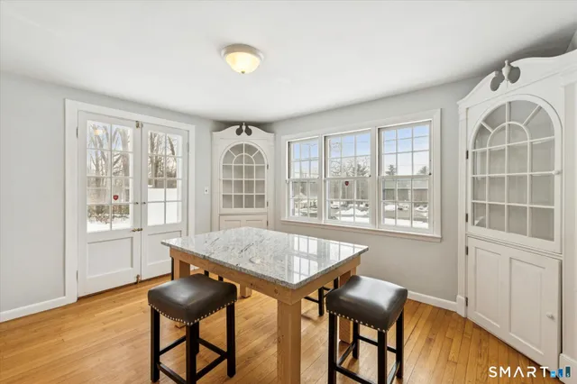 a view of a dining room with furniture window and outside view