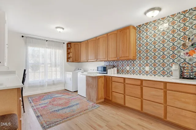 a bedroom with a large bed a flat tv screen and balcony