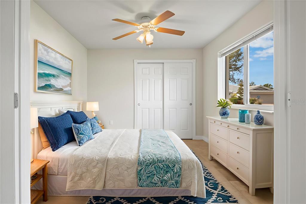 13222 Huerta Street Venice, FL 34293 - Photo 23 of 85 a bedroom with a bed and a window