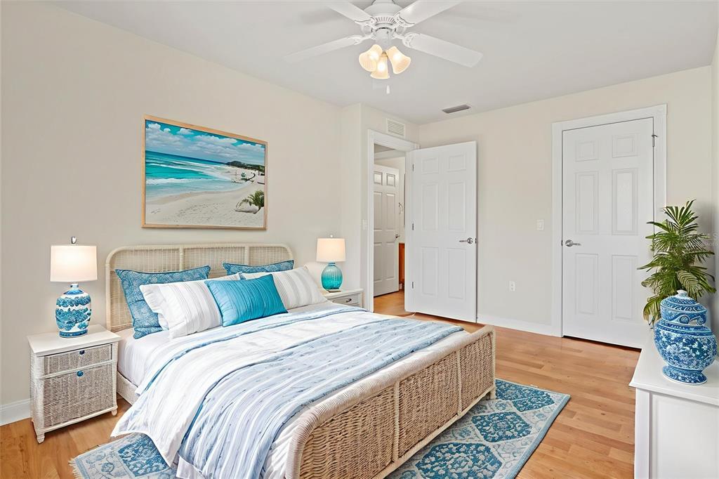 13222 Huerta Street Venice, FL 34293 - Photo 36 of 85 a bedroom with a bed and a chandelier