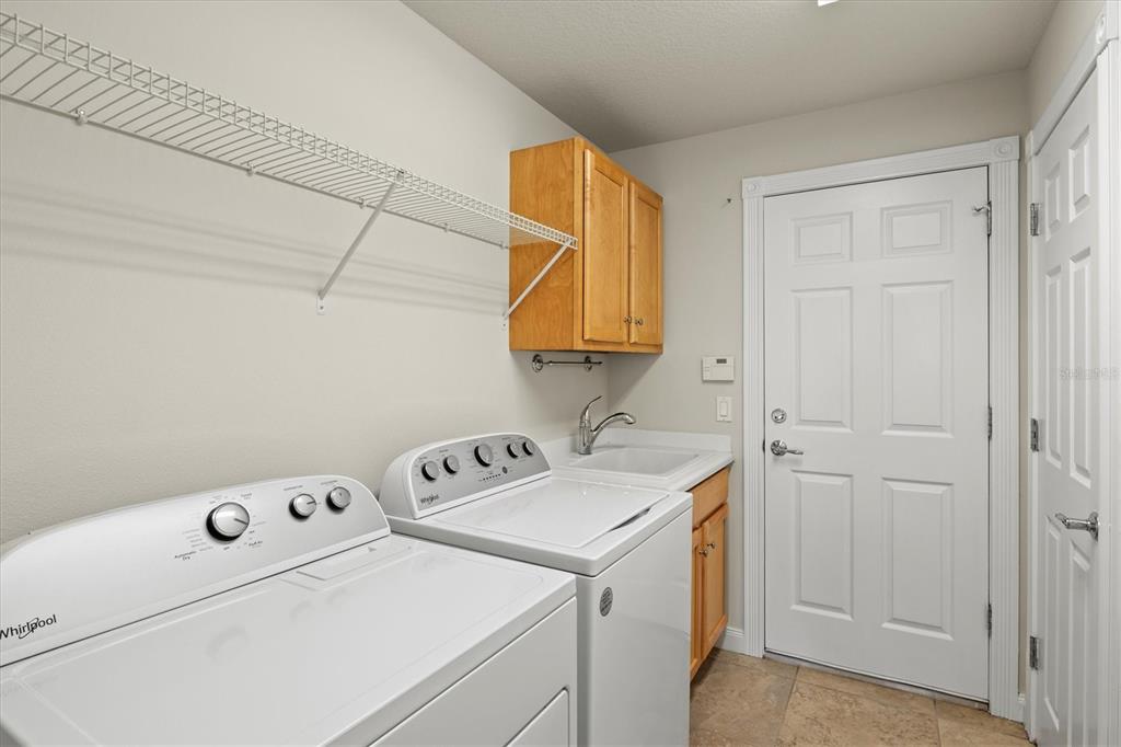 13222 Huerta Street Venice, FL 34293 - Photo 39 of 85 a utility room with dryer and washer