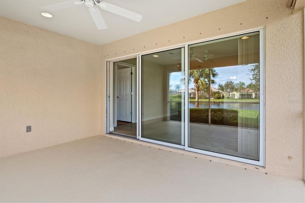 13222 Huerta Street Venice, FL 34293 - Photo 44 of 85 a view of a glass door with a big room