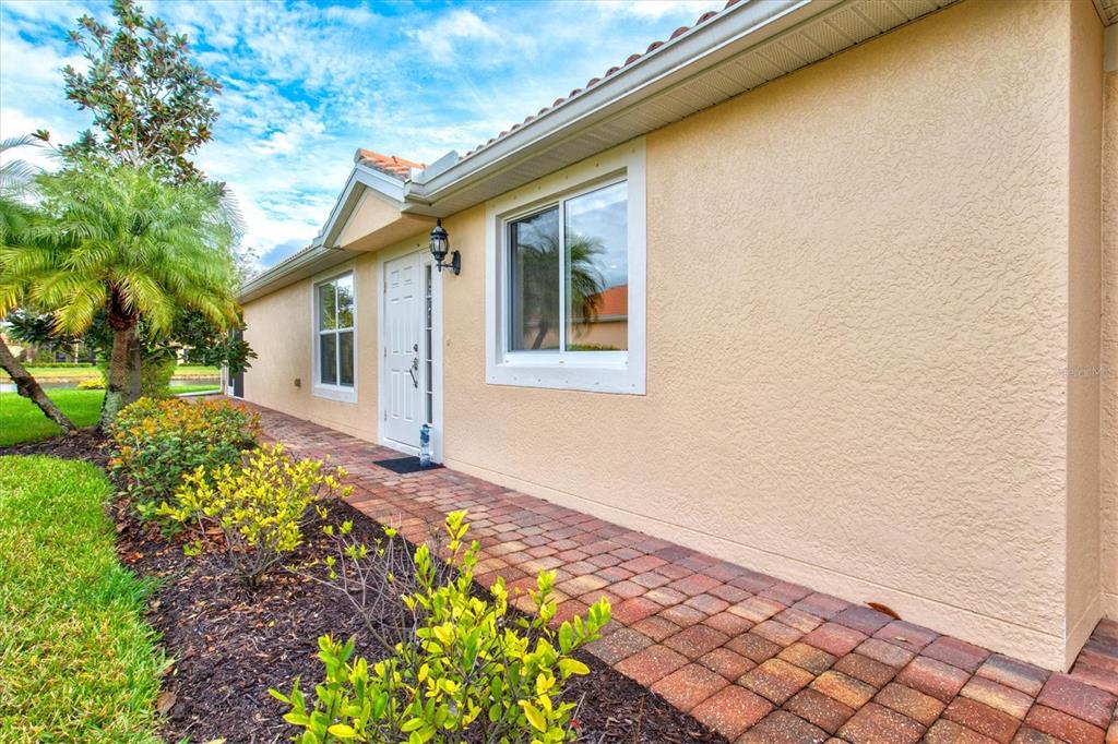 13222 Huerta Street Venice, FL 34293 - Photo 5 of 85 a front view of a house with a yard