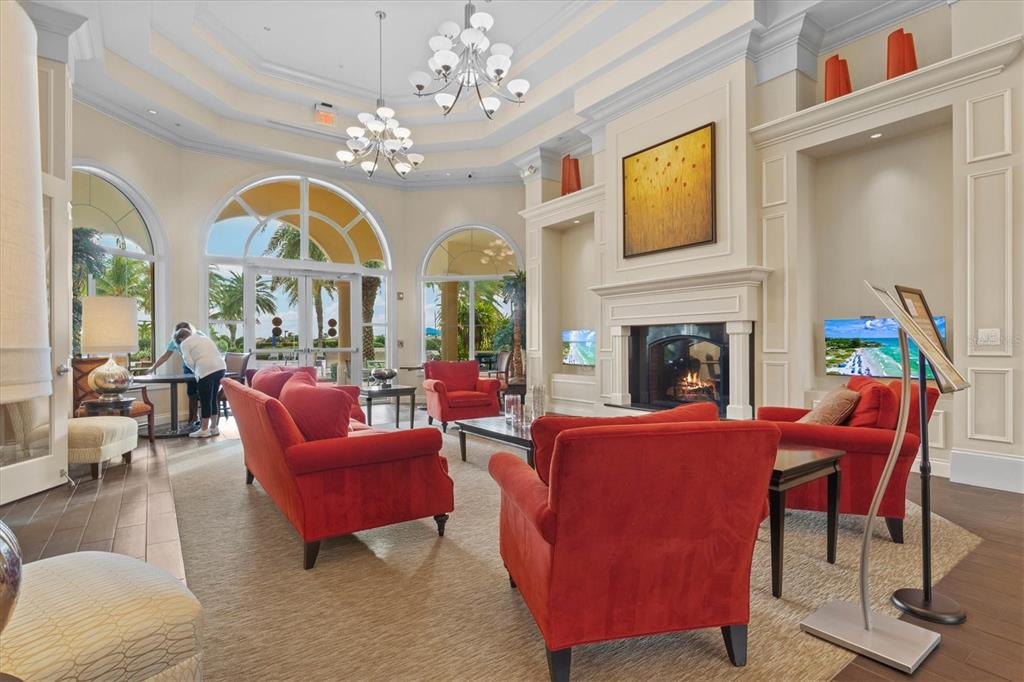 13222 Huerta Street Venice, FL 34293 - Photo 58 of 85 a living room with furniture fireplace and a large window