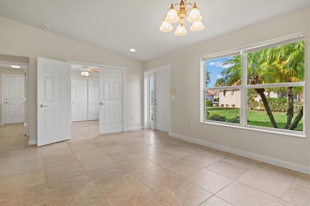 13222 Huerta Street Venice, FL 34293 - Photo 9 of 85 an empty room with windows and outdoor view