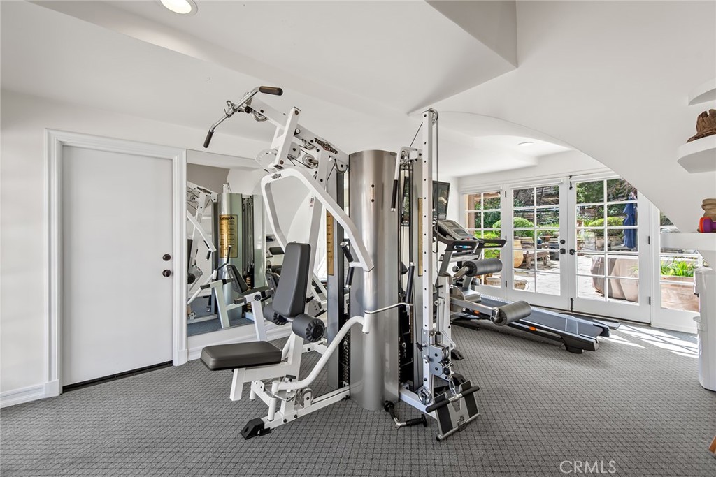 24308 Bridle Trail Road Hidden Hills, CA 91302 - Photo 12 of 29 a view of a room with gym equipment