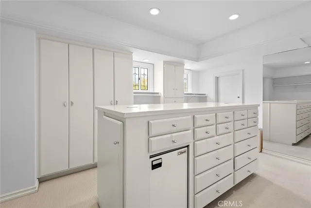 a bedroom with two beds and a couch