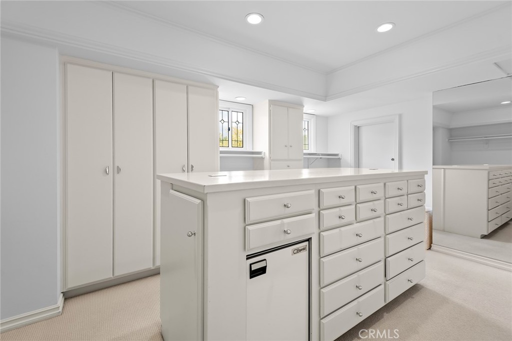 24308 Bridle Trail Road Hidden Hills, CA 91302 - Photo 16 of 29 a kitchen with cabinets appliances