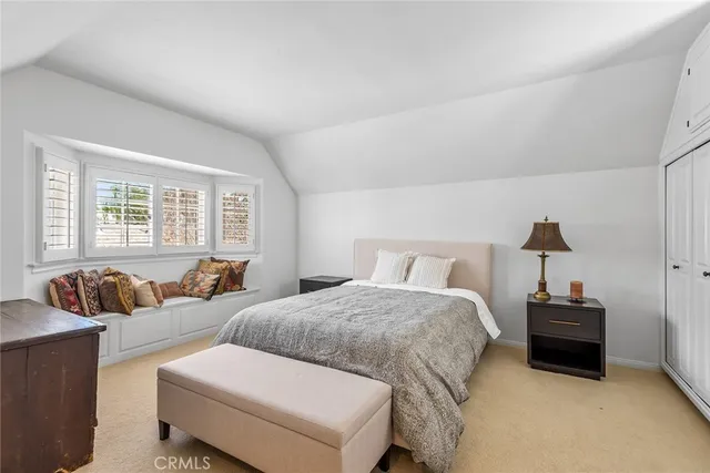 a spacious bathroom with a tub double sink and mirror