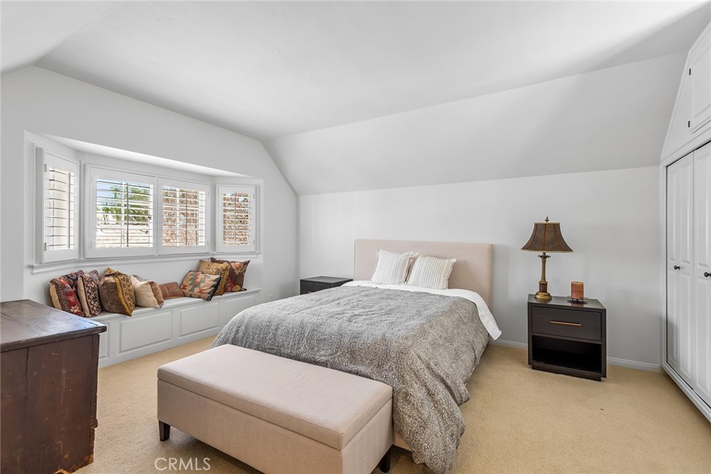 24308 Bridle Trail Road Hidden Hills, CA 91302 - Photo 17 of 29 a bedroom with two beds and a couch