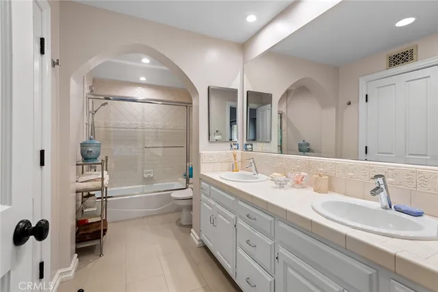 a bedroom with a bed and a cabinets