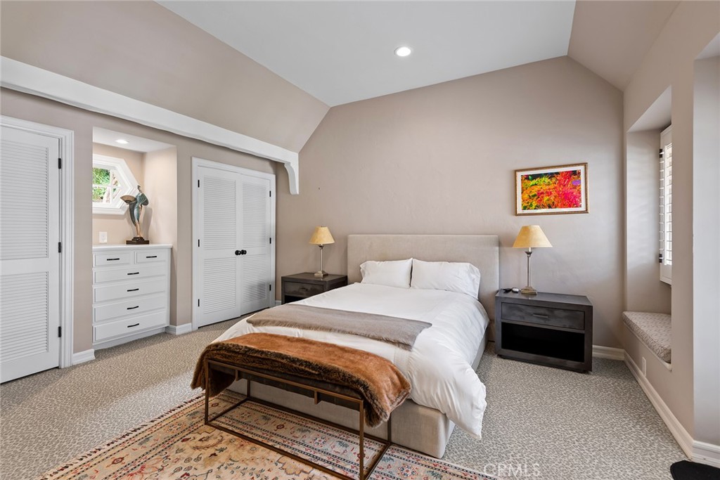 24308 Bridle Trail Road Hidden Hills, CA 91302 - Photo 19 of 29 a bedroom with a bed and a cabinets