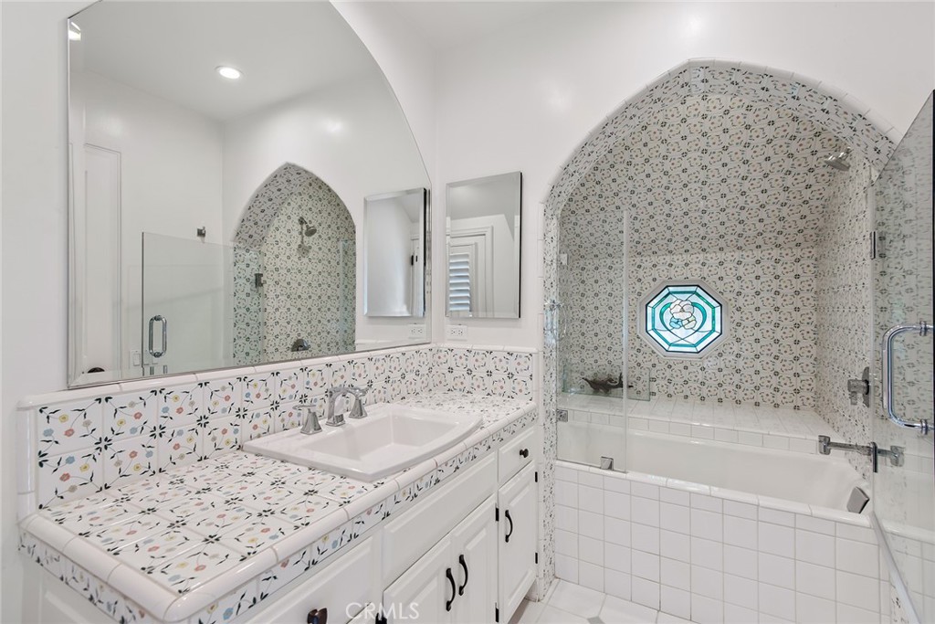 24308 Bridle Trail Road Hidden Hills, CA 91302 - Photo 22 of 29 a bathroom with a bathtub and a sink