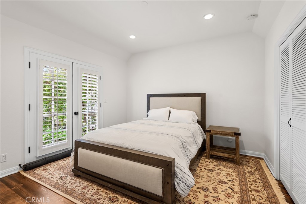 24308 Bridle Trail Road Hidden Hills, CA 91302 - Photo 23 of 29 a bedroom with a large bed and a window