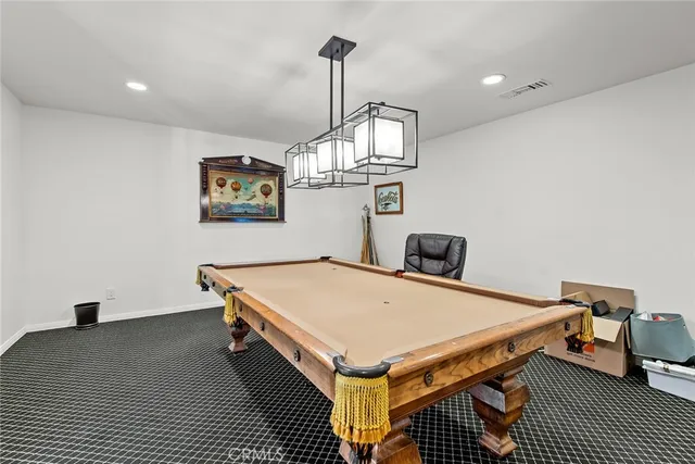 a view of a backyard with sitting area