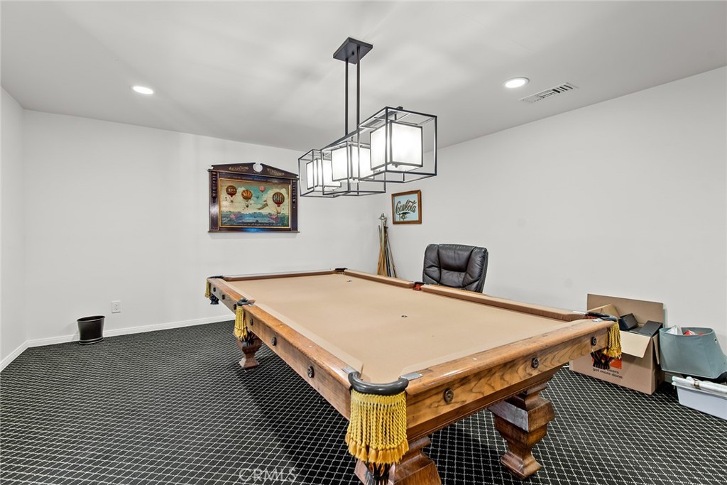 24308 Bridle Trail Road Hidden Hills, CA 91302 - Photo 26 of 29 a room with table and a chandelier