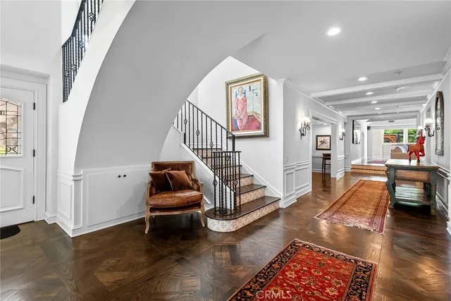 a living room with furniture and a rug