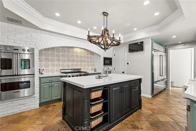 a kitchen with a sink stainless steel appliances and cabinets