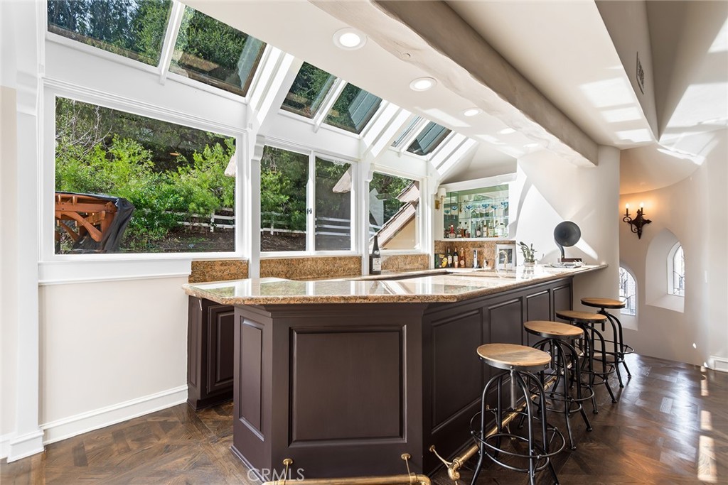 24308 Bridle Trail Road Hidden Hills, CA 91302 - Photo 9 of 29 a view of a kitchen from a dining room