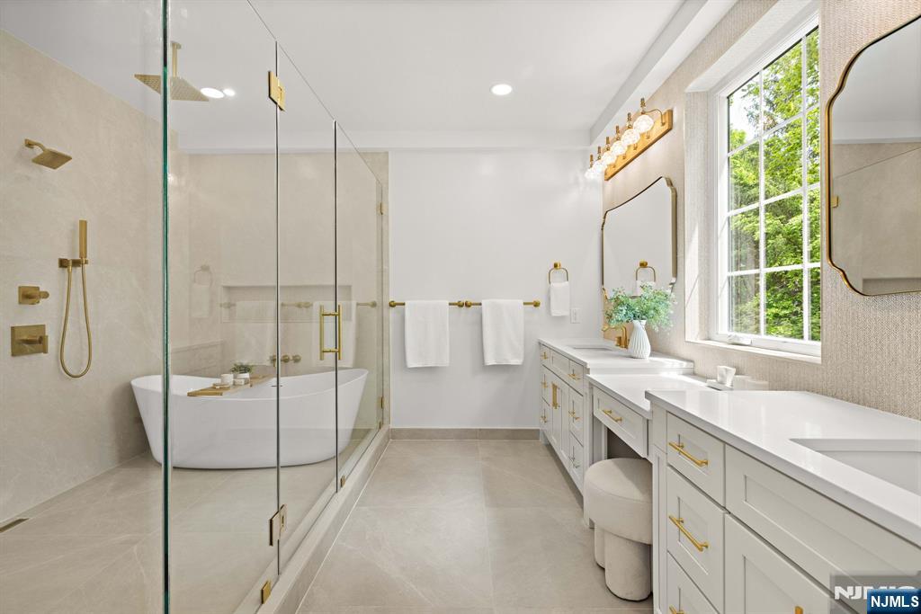 14 Beechwood Road Ho-Ho-Kus, NJ 07423 - Photo 11 of 31 a bathroom with a granite countertop sink a toilet and shower