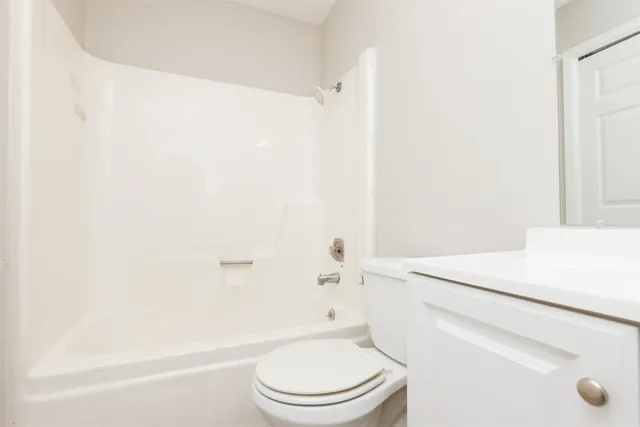 a bathroom with a toilet a sink and a bathtub