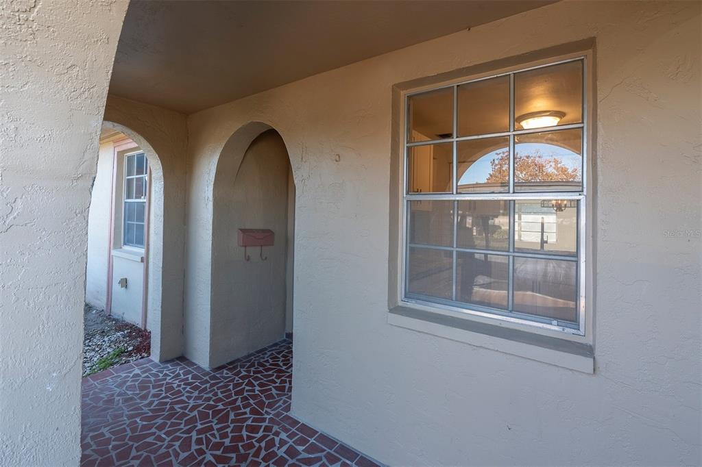 4343 Summersun Drive, Unit 4343 New Port Richey, FL 34652 - Photo 2 of 50 a view of a wooden door with a glass door
