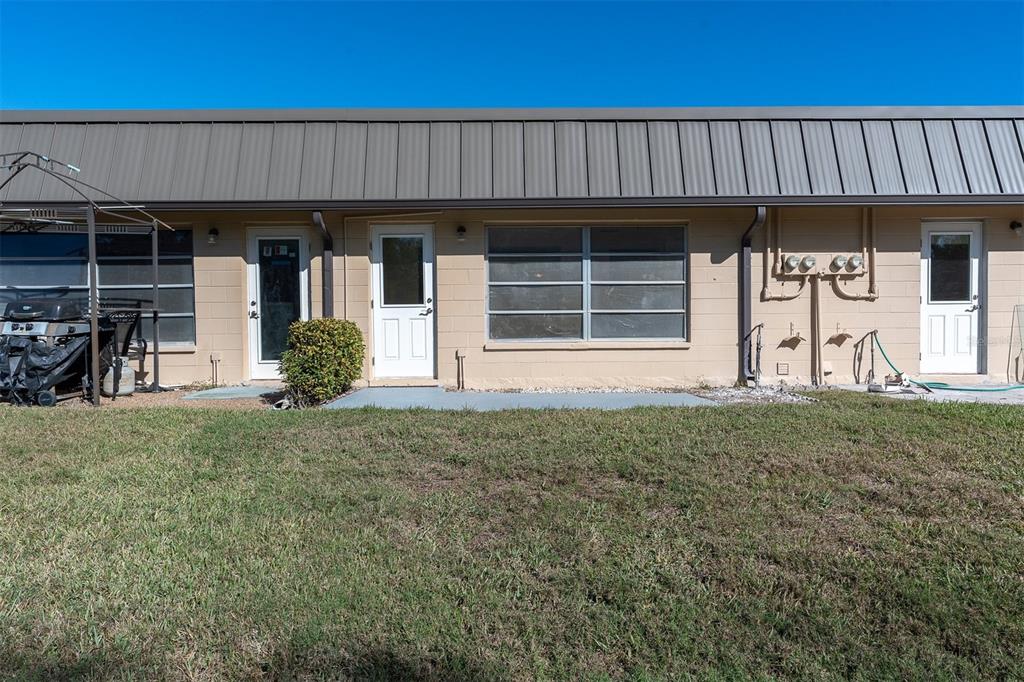 4343 Summersun Drive, Unit 4343 New Port Richey, FL 34652 - Photo 28 of 50 a front view of a house having garden