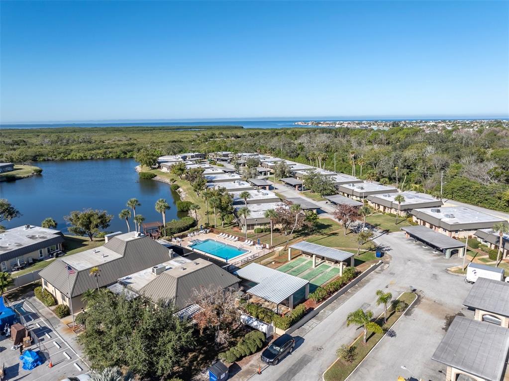 4343 Summersun Drive, Unit 4343 New Port Richey, FL 34652 - Photo 41 of 50 an aerial view of residential houses with outdoor space