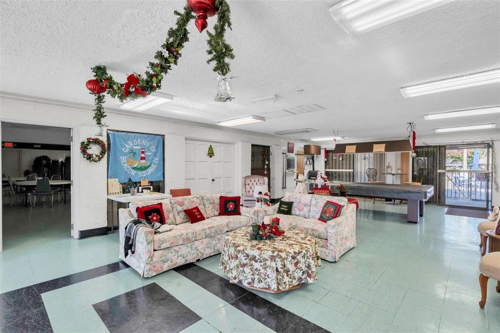 4343 Summersun Drive, Unit 4343 New Port Richey, FL 34652 - Photo 42 of 50 a living room with furniture and a potted plant