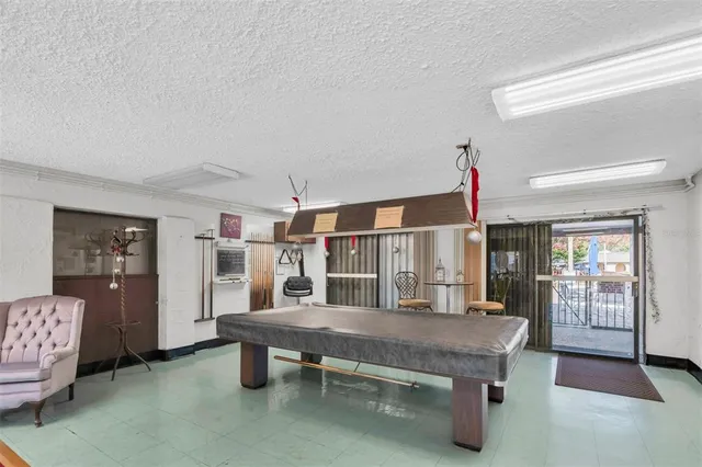 a kitchen with a stove and a refrigerator
