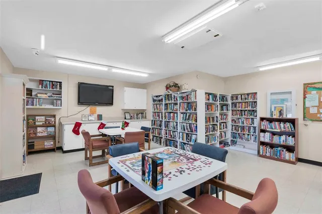 a large white kitchen with cabinets