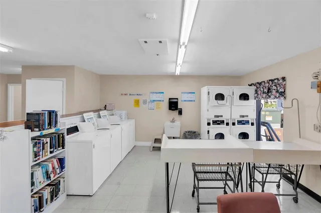 a view of a lake with couches chairs