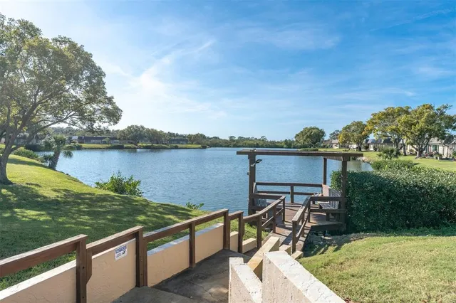 a view of sitting area with furniture and lake view