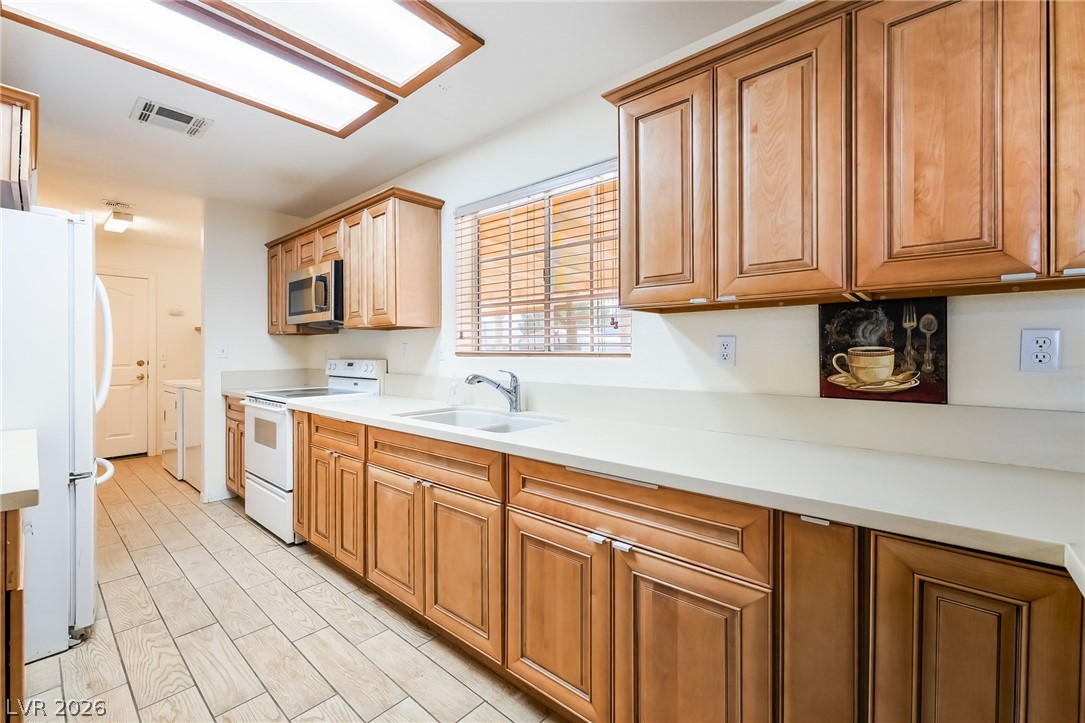 3631 South Blagg Road Pahrump, NV 89048 - Photo 15 of 47 A well-appointed kitchen features ample cabinetry, generous counter space, and durable tile flooring.