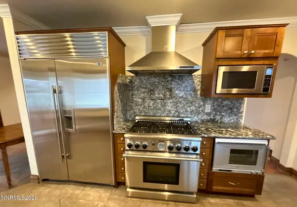 a kitchen with a stove and a microwave