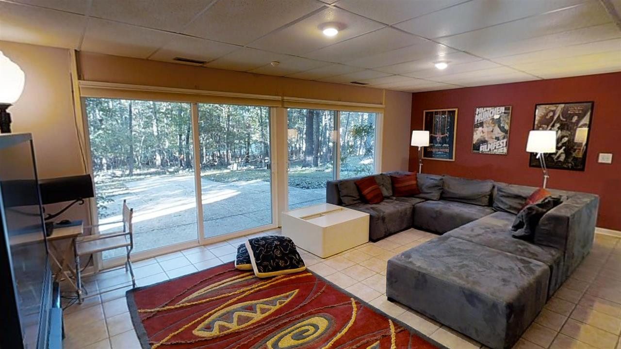 126 Chateau Road Durham, NC 27704 - Photo 15 of 25 Sliding doors lead to aggregate patio and back yard. Family Room
