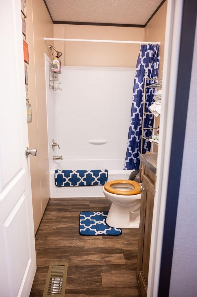 4526 Mt Pleasant Road Cohutta, GA 30710 - Photo 17 of 24 a bathroom with a bathtub and shower
