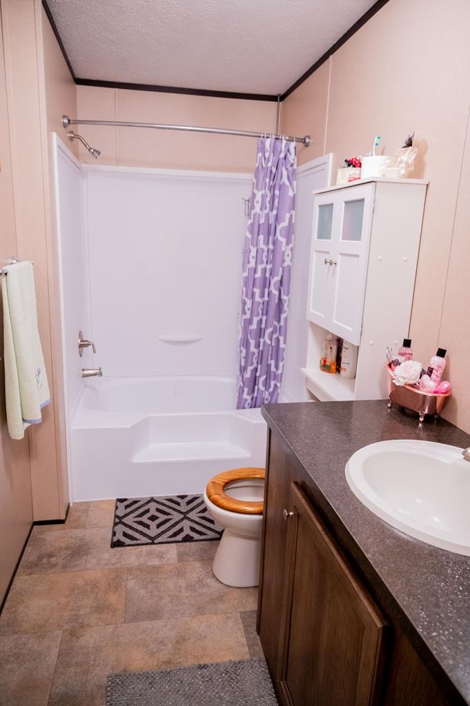4526 Mt Pleasant Road Cohutta, GA 30710 - Photo 19 of 24 a bathroom with a sink toilet and shower
