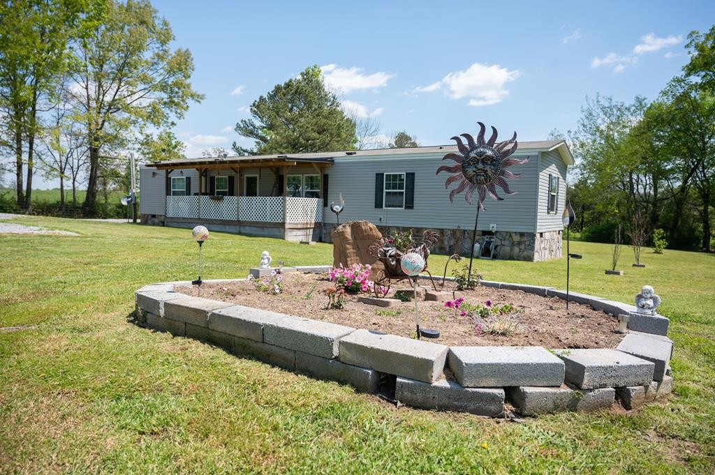 4526 Mt Pleasant Road Cohutta, GA 30710 - Photo 6 of 24 a view of a house with backyard swimming pool and sitting area