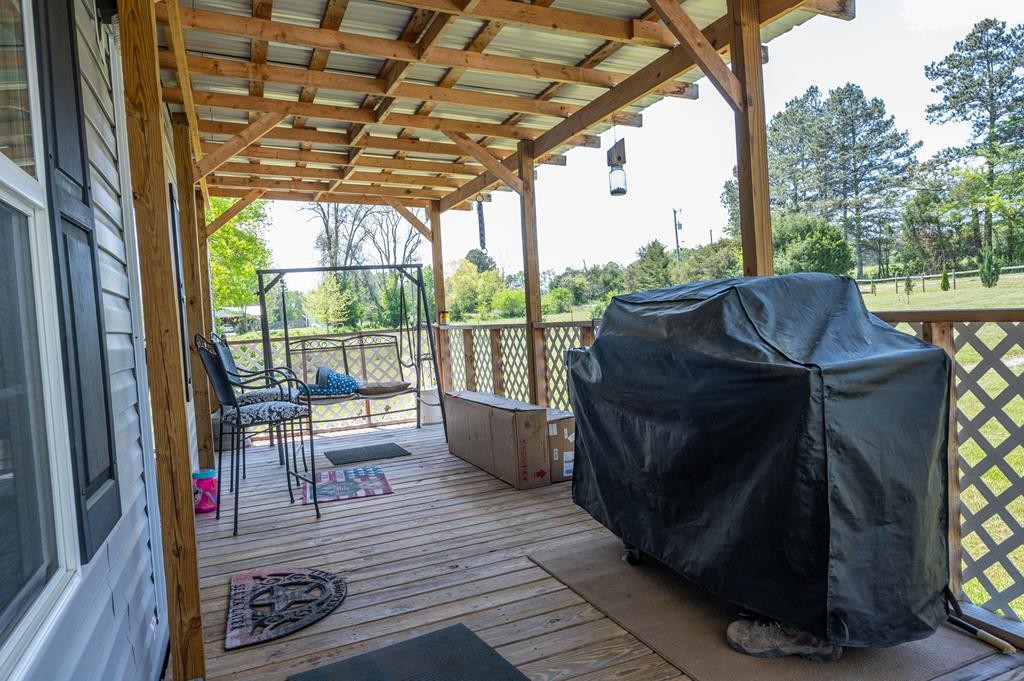 4526 Mt Pleasant Road Cohutta, GA 30710 - Photo 8 of 24 a view of balcony with couch and wooden floor