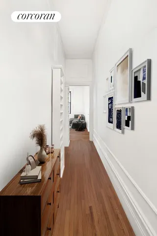a view of a workspace with furniture and wooden floor