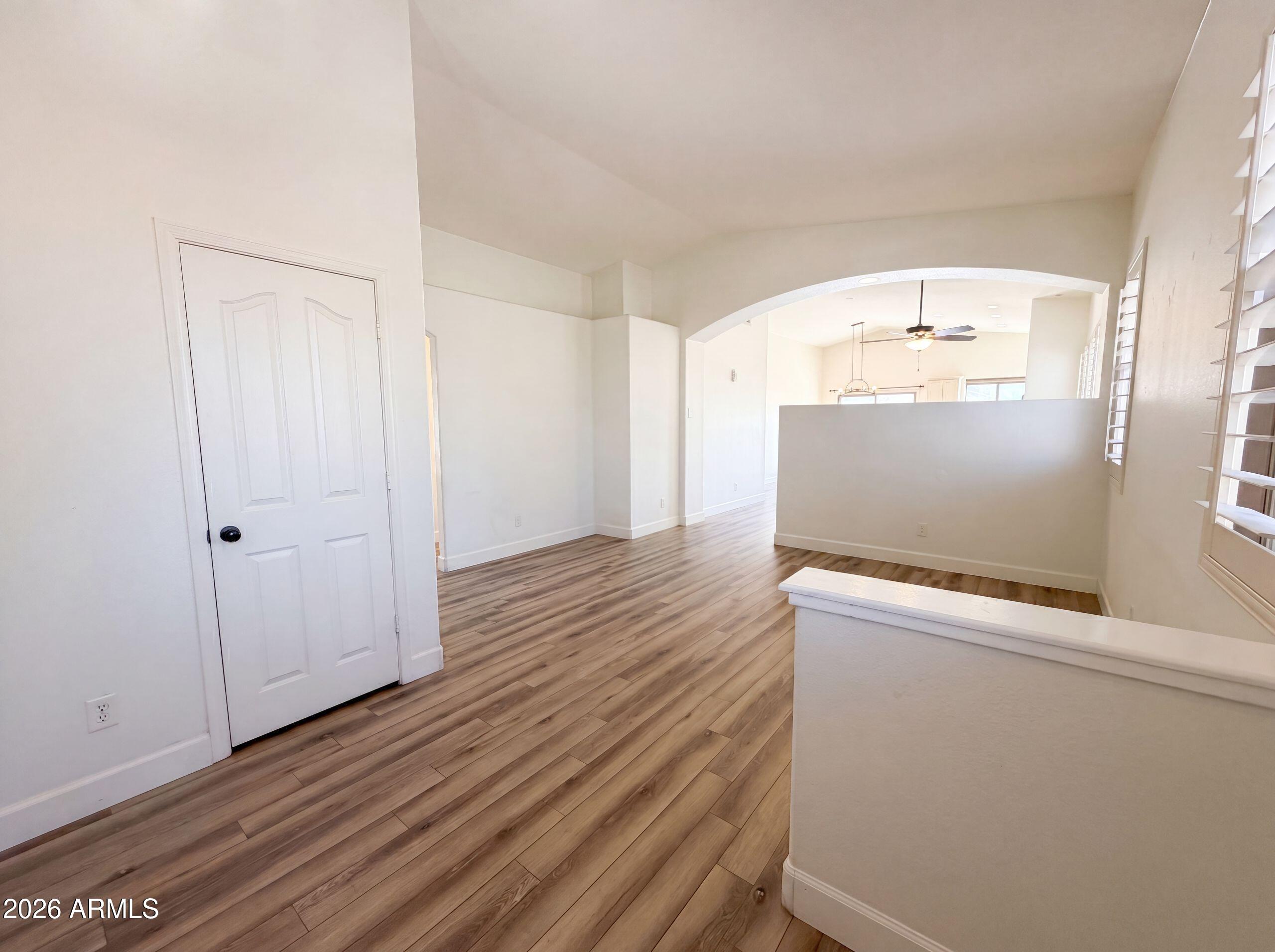 3951 East Timberline Road Gilbert, AZ 85297 - Photo 14 of 28 a view of a hallway with wooden floor