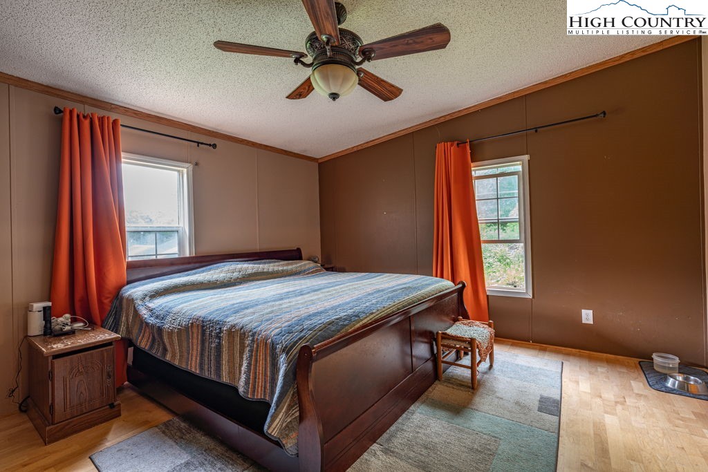 285 Roaring Fork Road Todd, NC 28684 - Photo 20 of 41 a bedroom with a bed and window