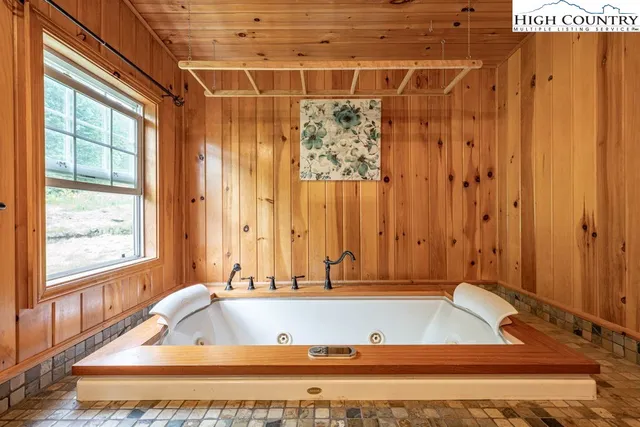 a view of a workspace with furniture and gym equipment