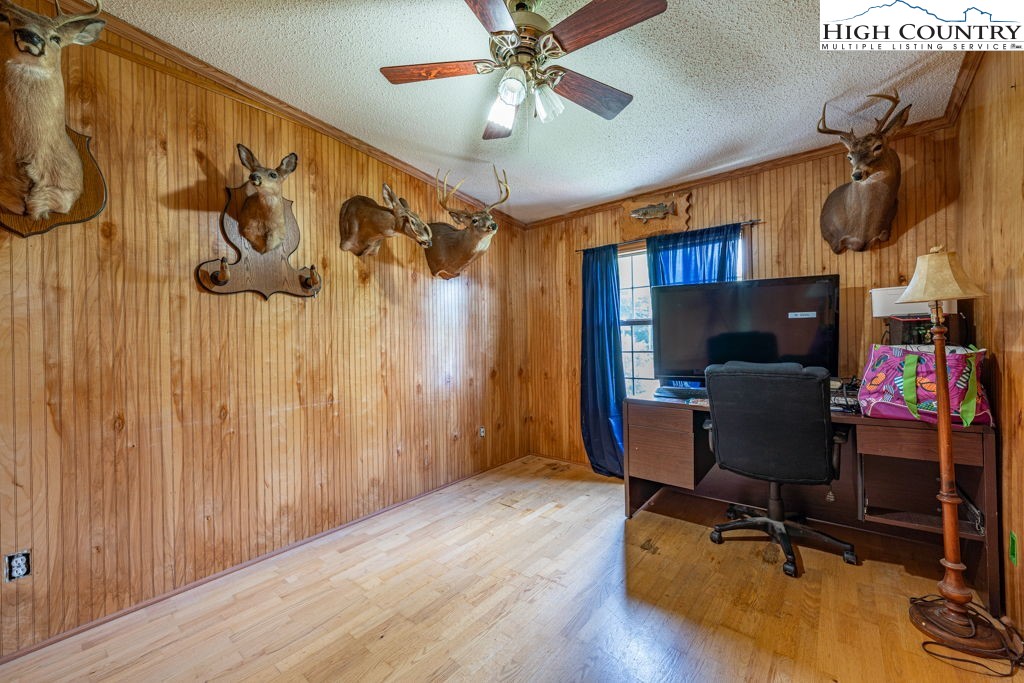 285 Roaring Fork Road Todd, NC 28684 - Photo 26 of 41 a view of a workspace with furniture and gym equipment