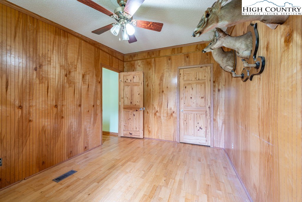 285 Roaring Fork Road Todd, NC 28684 - Photo 27 of 41 a view of a room with wooden floor and windows