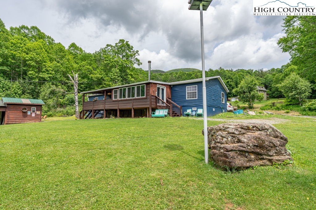 285 Roaring Fork Road Todd, NC 28684 - Photo 3 of 41 a view of a house with a backyard